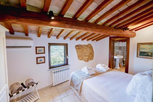 a bedroom with a bed in a room at Villa Destino Italy, Umbria Tuscany boarder in Montone