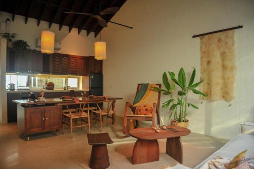 a kitchen and dining room with a table and chairs at Camfusion House in Hoi An