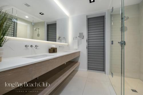 a bathroom with a sink and a shower at Long Bay Beach Club in Long Bay Hills