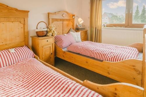Кровать или кровати в номере Kaminhaus 3 Fehmarn mit Sauna und Kamin