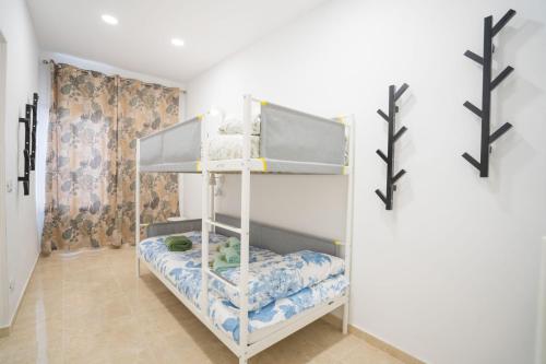 a bedroom with a bunk bed in a room at Casa Rural da Eva in Santa Cruz de Tenerife