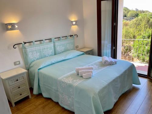 Postel nebo postele na pokoji v ubytování Matty & Yla - Costa Smeralda -