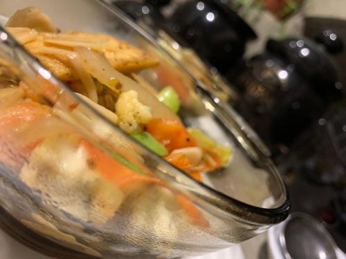 a bowl of food with vegetables in it at Enchanted Villa in Kandy