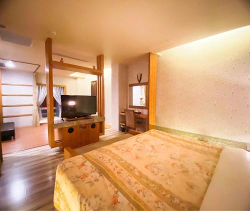 フア シーアン モーテルにあるテレビまたはエンターテインメントセンター