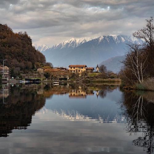 a view of a lake with mountains in the background at Casa vacanze "INCANTO DEL LAGO" in Corna