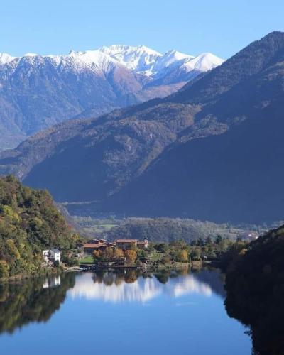 a view of a lake with mountains in the background at Casa vacanze "INCANTO DEL LAGO" in Corna