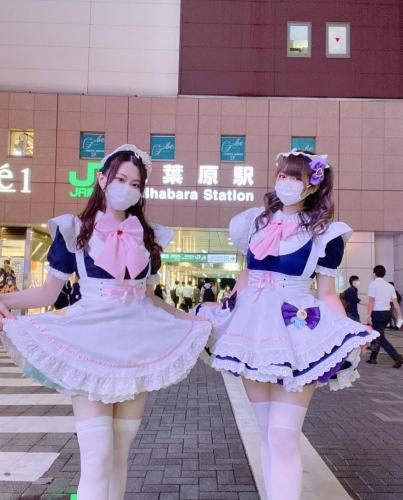 two girls dressed in costumes standing on a street at Alo BnB 10 - Near AKIHABARA, UENO, ASAKUSA, TOKYO SKY TREE - Self check-in in Tokyo