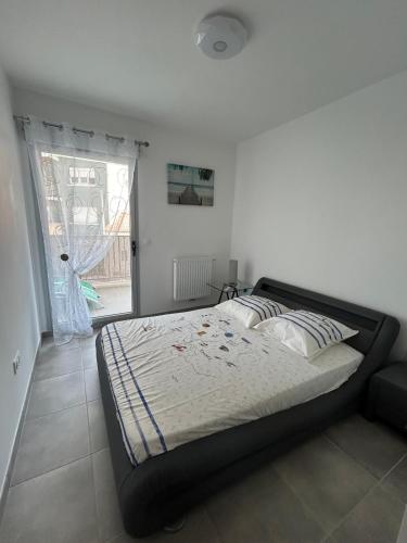 Ένα ή περισσότερα κρεβάτια σε δωμάτιο στο Appartement T3 Royan plage