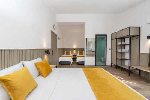 Postel nebo postele na pokoji v ubytování Lemon Hotel