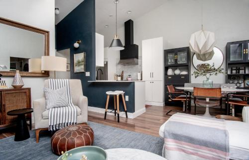 a living room with a couch and a dining room at Peaceful, modern, renovated, close to everything! in Gainesville