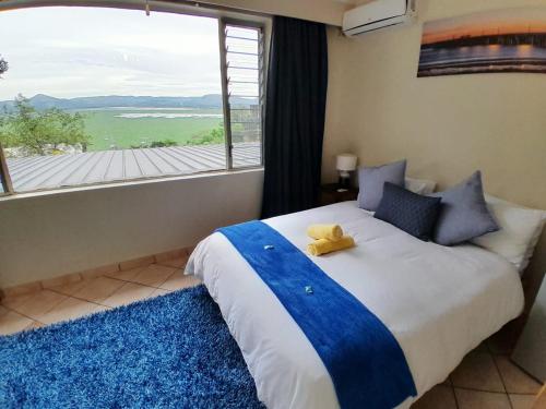 Ένα ή περισσότερα κρεβάτια σε δωμάτιο στο Yacht View Lodge
