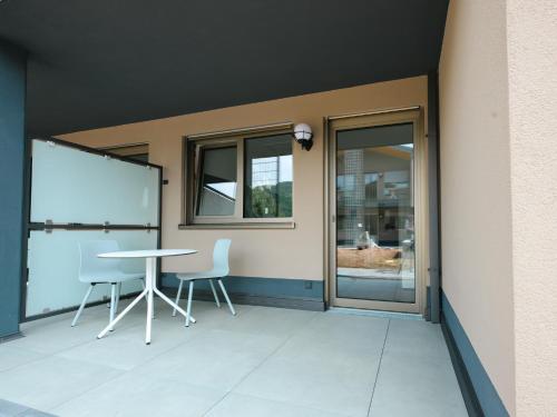 Un balcón o terraza en Altes Kelterhaus & Plein Hotel by Markus Plein