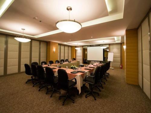 a large conference room with a long table and chairs at Executives Hotel - Olaya in Riyadh