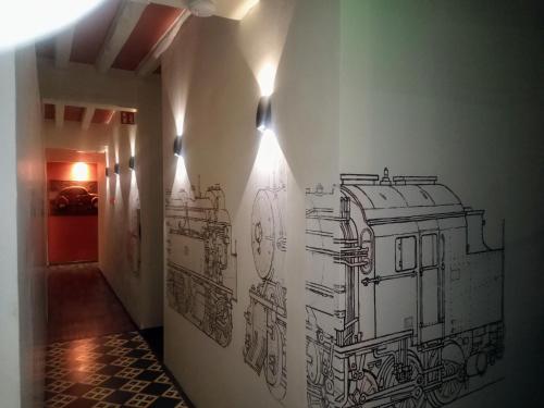a drawing of a train on a wall in a hallway at KolMojen in Sint-Truiden