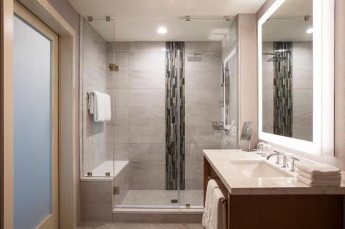 a bathroom with a shower and a sink at The Westin Chattanooga in Chattanooga