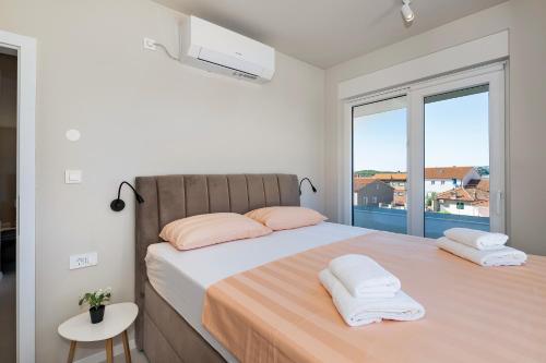 Posteľ alebo postele v izbe v ubytovaní Providenca Residence