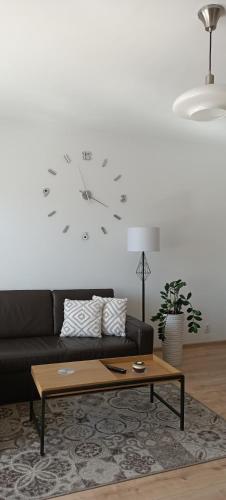 Posezení v ubytování Pomaranczowa Apartment