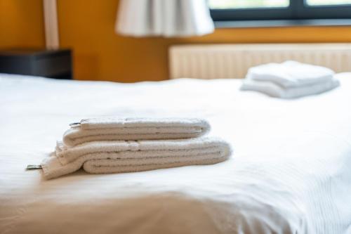 Ένα ή περισσότερα κρεβάτια σε δωμάτιο στο Lake Suites