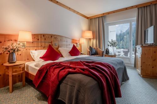Postel nebo postele na pokoji v ubytování AROSA ALPINE CLUB - Adults only