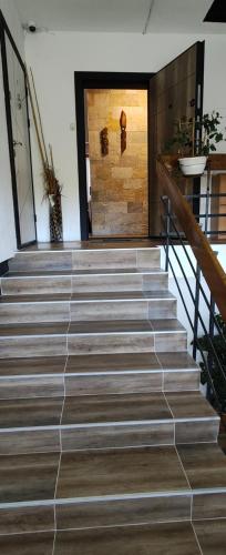 a set of stairs in a building with a door at Студио Странджа - Граматиково in Gramatikovo