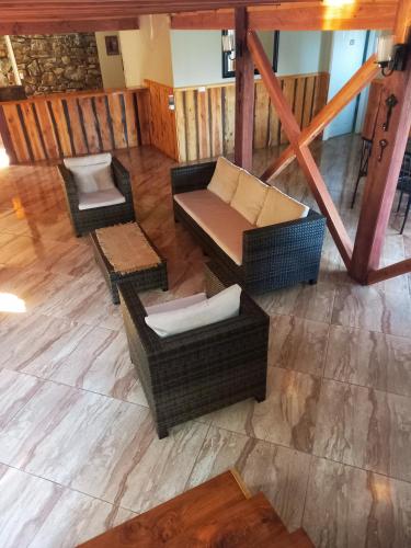 an overhead view of a living room with couches and chairs at Nido Del Bosque in Pucón