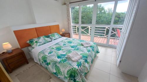 Postel nebo postele na pokoji v ubytování Kay Nou Apartments