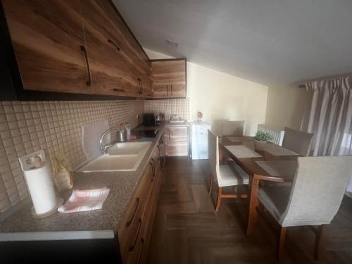 a kitchen with a sink and a counter top at Retreat in the centre of Korce in Korçë