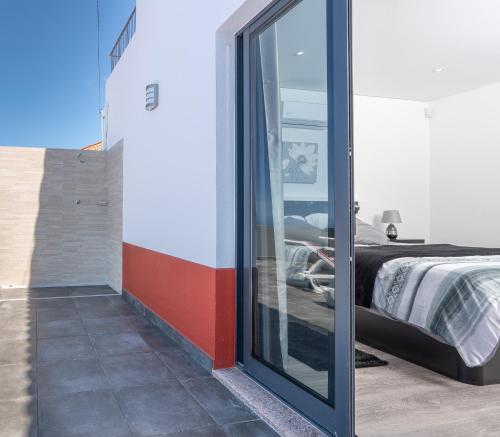 Ένα ή περισσότερα κρεβάτια σε δωμάτιο στο Roraima House - Private Pool & Garden