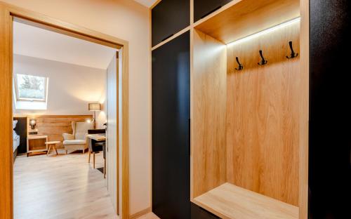 a door leading into a room with a living room at Penzion U Mě in Obora