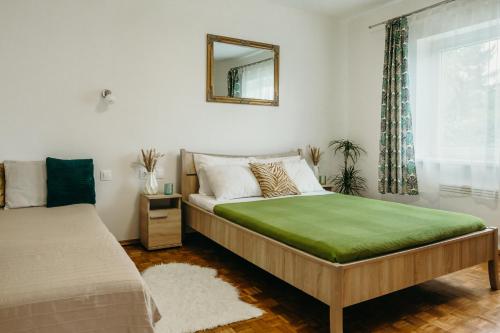 Postel nebo postele na pokoji v ubytování Villa Vonyarc