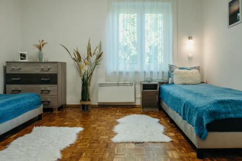 Postel nebo postele na pokoji v ubytování Villa Vonyarc