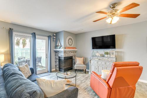 a living room with a couch and a fireplace at Galveston Couples Retreat quarter Mi to Seawall in Galveston