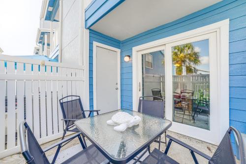 a patio with a table and chairs on a balcony at Galveston Couples Retreat quarter Mi to Seawall in Galveston