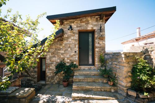 a stone house with stairs leading to a door at LUXURY STUDIO in Veliko Tŭrnovo