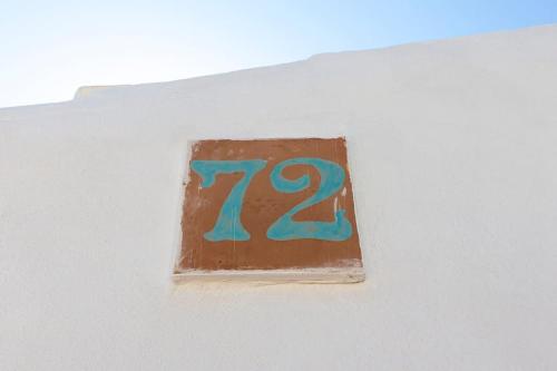 a chocolate cake with the number on it at Incantevole Vista Mare, 450mt Spiaggia Kal'e Moru in Geremèas
