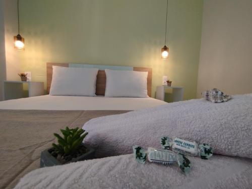two beds in a room with two beds sidx sidx sidx at Marine Sea View in Kavala