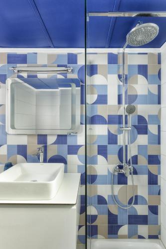 a bathroom with a sink and a shower at Villino Blu by the sea in Gouves