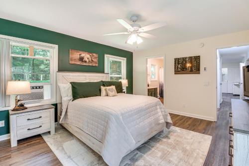 a bedroom with a bed and a ceiling fan at 7 Mi to Big Boulder Resort-Style Poconos Retreat in Albrightsville