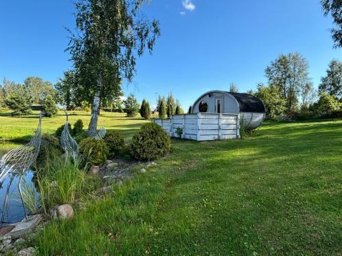 a dome tent sitting in the grass in a field at Residence R&R in Karvys