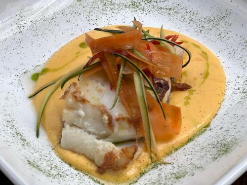 a plate of food on a white plate at LA CASONA DE PALMIRA in Caín