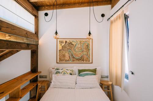 a bedroom with a bed and a painting on the wall at LUXURY STUDIO in Veliko Tŭrnovo