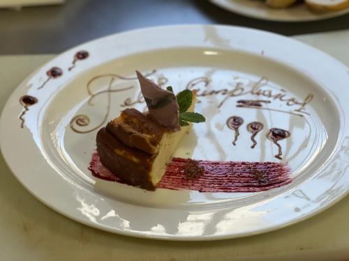 a piece of cake on a plate on a table at LA CASONA DE PALMIRA in Caín
