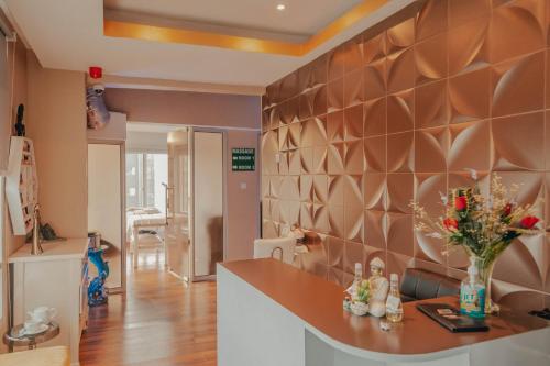 a kitchen with a counter with a vase of flowers at Holiday Inn Dar Es Salaam by IHG in Dar es Salaam