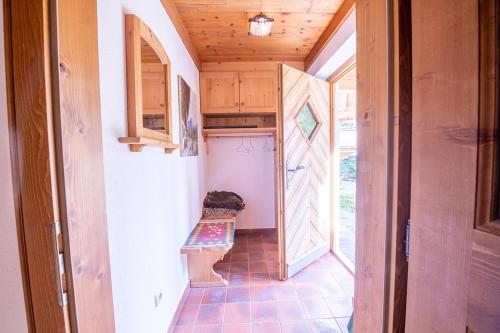 a tiny house with a hallway leading to a kitchen at Polle Hütte EG in Königsleiten