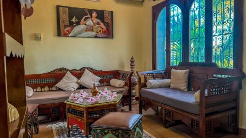 Una cama o camas en una habitación de Hotel de charme et SPA Dar El Bhar