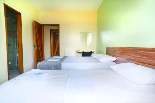 Ένα ή περισσότερα κρεβάτια σε δωμάτιο στο Hotel Pinheiro