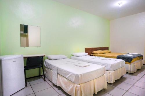 Ένα ή περισσότερα κρεβάτια σε δωμάτιο στο Hotel Pinheiro