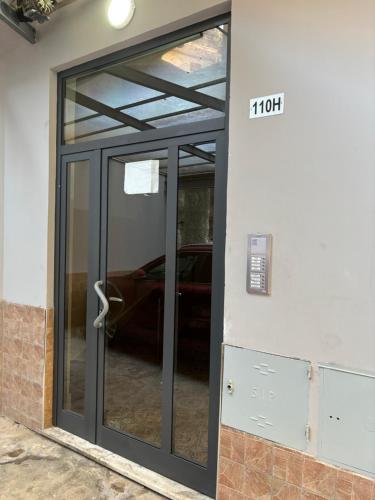 a glass door of a garage with a car in it at B&B da Nonno Mario in Battipaglia