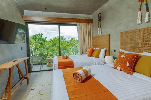 Ένα ή περισσότερα κρεβάτια σε δωμάτιο στο Prime Location TULUM