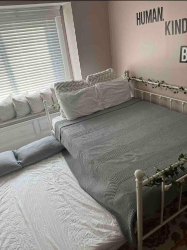 a bedroom with a bed and a window at Stained Glass Serenity Suite in Cleveland